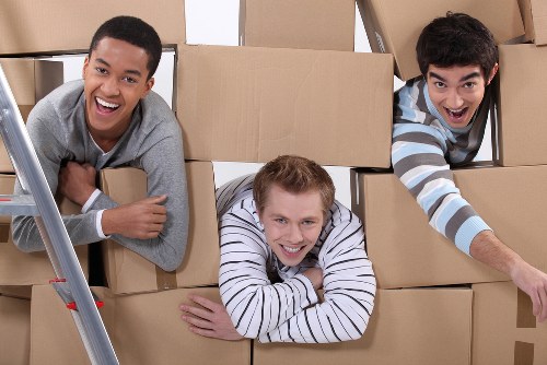 Packed boxes and wrapped furniture prepared for a local home move in Roehampton