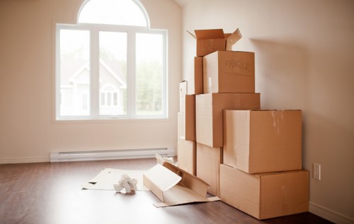 Packed boxes and furniture ready for a house move in Roehampton