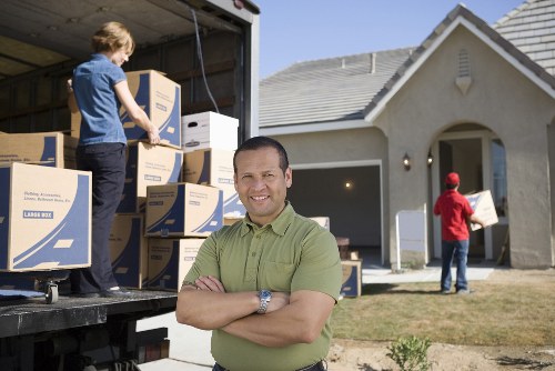 Trained movers handling furniture safely during relocation