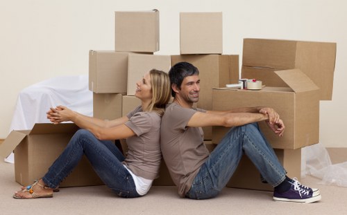Packed moving boxes and wrapping materials for a home move in Roehampton