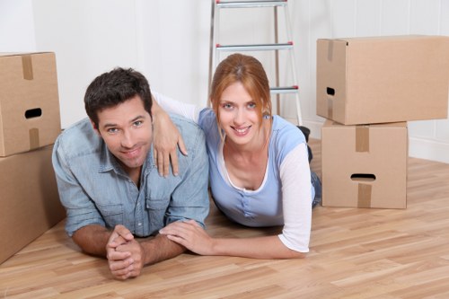 Professional movers handling office furniture in Roehampton