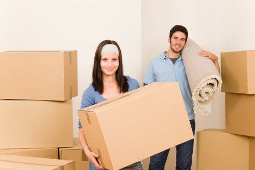 Moving team loading business items with care in Roehampton