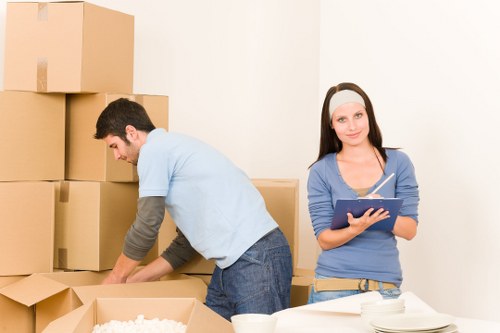 Careful loading of household belongings for a Roehampton move with practical access considerations