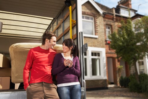 Careful wrapping of fragile household items during a local move